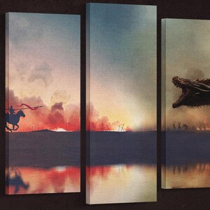 May include: A multi-panel canvas art print depicting a fiery sunset scene with a lone rider on horseback in the foreground. The right panel features a dragon emerging from the flames, creating a dramatic contrast.