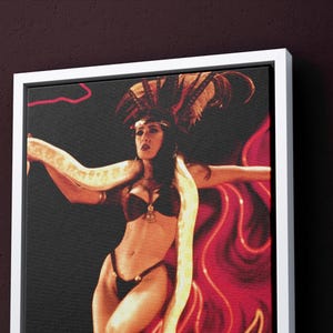 May include: A woman wearing a red and black costume with a snake wrapped around her body. She is posing in front of a red and white background.