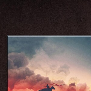 May include: A silhouette of a person riding a horse with a red flag, against a backdrop of a dramatic, fiery sunset sky with clouds.