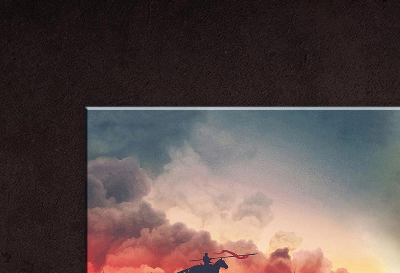 May include: A silhouette of a person riding a horse with a red flag, against a backdrop of a dramatic, fiery sunset sky with clouds.