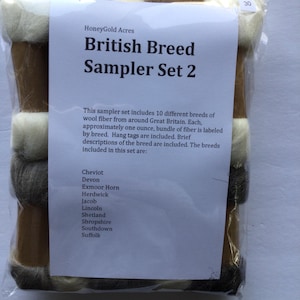 May include: A sampler set of 10 different British wool fibers, each approximately one ounce. The set includes Cheviot, Devon, Exmoor Horn, Herdwick, Jacob, Lincoln, Shetland, Shropshire, Southdown, and Suffolk wool fibers. Each fiber is labeled with a hang tag and a brief description of the breed.