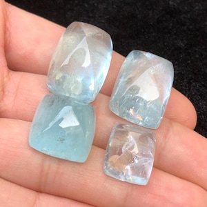 aquamarine cabochons, weight 145 , size 16mm to 25.5mm
