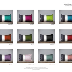 May include: A set of 12 silk pillow covers with a colorblock design. Each pillow cover features a white stripe in the center and a solid color on either side. The colors include turquoise, fuchsia, peridot, teal, copper, olive, midnight, ruby, orchid, pastel pink, aquamarine, and rose.