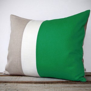 May include: A rectangular cushion with three horizontal stripes. The stripes are beige, white, and a bright green. The cushion is made of a soft, textured fabric.