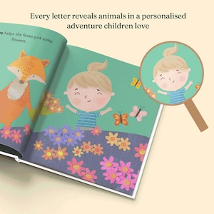 May include: A children's book open to a page featuring a cartoon fox, a child with a blonde ponytail in a blue striped shirt, and colorful flowers. Text reads: Every letter reveals animals in a personalized adventure children love and helps the foxes pick some flowers.
