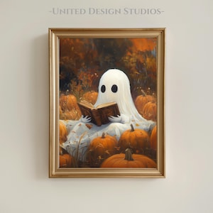 May include: A framed painting depicts a white ghost reading a book in a pumpkin patch. The ghost has two black oval eyes and is draped in a white sheet. The pumpkins are orange, and the background is a mix of orange and brown.