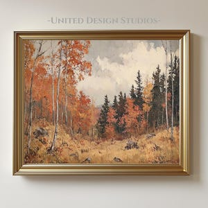 Puede incluir: Pintura de paisaje enmarcada que representa una escena de bosque otoñal. La obra muestra árboles con vibrantes hojas naranjas y amarillas, sobre un cielo nublado. El marco dorado rodea la pintura, y el texto "-UNITED DESIGN STUDIOS-" es visible en la parte superior.