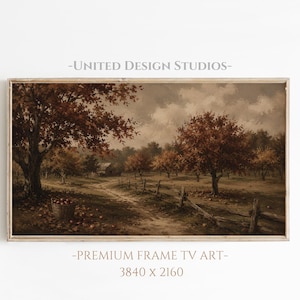 May include: A landscape painting in a wooden frame depicting an autumn orchard with brown and orange trees, a dirt path, a wooden fence, and a basket of apples under a cloudy sky. Text reads UNITED DESIGN STUDIOS, PREMIUM FRAME TV ART, 3840 x 2160.