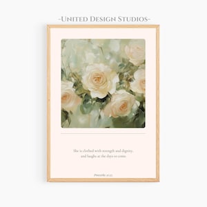 Può includere: Una stampa artistica incorniciata con un dipinto floreale di rose color crema e foglie verdi. L'opera d'arte include il testo "È rivestita di forza e dignità, e ride dei giorni a venire. Proverbi 31:25."