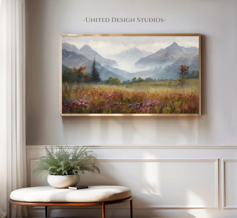 May include: A painting of a misty mountain landscape with a field of wildflowers in the foreground. The mountains are a soft blue and purple, and the sky is a pale blue. The wildflowers are a variety of colors, including pink, purple, and yellow.