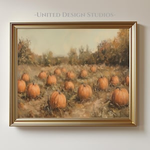 May include: A framed painting of a pumpkin patch. The artwork features numerous orange pumpkins scattered across a field of dry grass, with trees in the background. The frame is gold, and the text "-UNITED DESIGN STUDIOS-" is at the top.