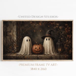 May include: Digital wall art for television displays featuring two white sheet ghosts and a carved jack-o'-lantern pumpkin. One ghost wears a dark pointed witch hat. The scene includes a lantern and autumn foliage, with text UNITED DESIGN STUDIOS.