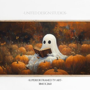 May include: A white ghost wearing a sheet sits in a field of pumpkins, reading a book. The ghost has two black eyes and a faint smile. The pumpkins are various shades of orange and are scattered throughout the field. The background is a blurry forest with autumn leaves.