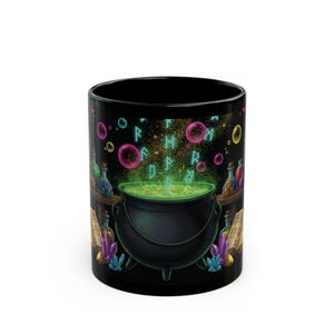 May include: A black ceramic mug featuring a graphic illustration of a dark cauldron filled with glowing green liquid. The design includes floating turquoise runes, colorful bubbles, open books, glass potion bottles, and purple crystals.