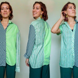 Op de afbeelding: Een lang mouw shirt met een groen en zwart gestreept patroon aan de ene kant en een groen en wit gestreept patroon aan de andere kant. Het shirt wordt gedragen met een donkergroene broek.
