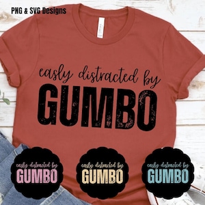May include: Rust-colored t-shirt with the phrase "easily distracted by GUMBO" in black, distressed lettering. Below the shirt are three black circular designs with the same text in various colors. The top left corner of the image has the text "PNG & SVG Designs".