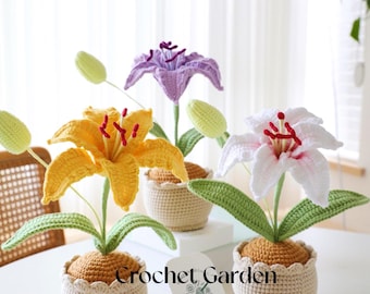 May include: Three crocheted lily flower arrangements in white, yellow, and purple. Each flower is in a crocheted pot with a brown base. The pots are sitting on a white table. The image includes the text "Crochet Garden by Layla".
