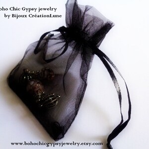 May include: A black sheer organza drawstring pouch containing metallic jewelry pieces. The text 'Boho Chic Gypsy jewelry by Bijoux Cr&eacute;ationLune' and the URL 'www.bohochicgypsyjewelry.etsy.com' are printed on the image in a black serif font.