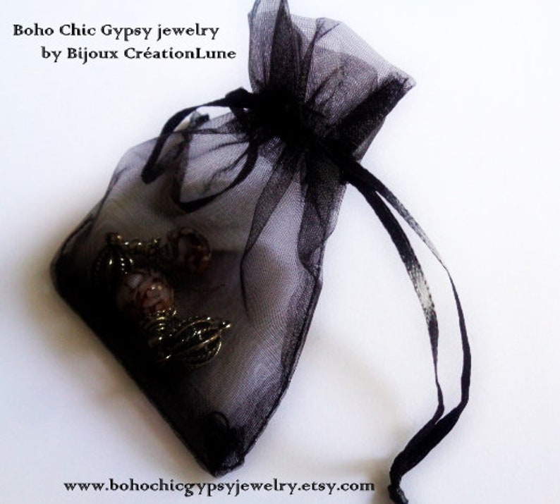 May include: A black sheer organza drawstring pouch containing metallic jewelry pieces. The text 'Boho Chic Gypsy jewelry by Bijoux Cr&eacute;ationLune' and the URL 'www.bohochicgypsyjewelry.etsy.com' are printed on the image in a black serif font.