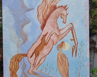 May include: An oil painting depicts a rearing winged horse with a rider and a figure with a halo. The artwork features a color palette of light brown, peach, and blue. The painting is displayed outdoors, leaning against a support.
