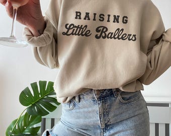 Raising Little Ballers Sweatshirt: Cozy Sports Mom Crewneck