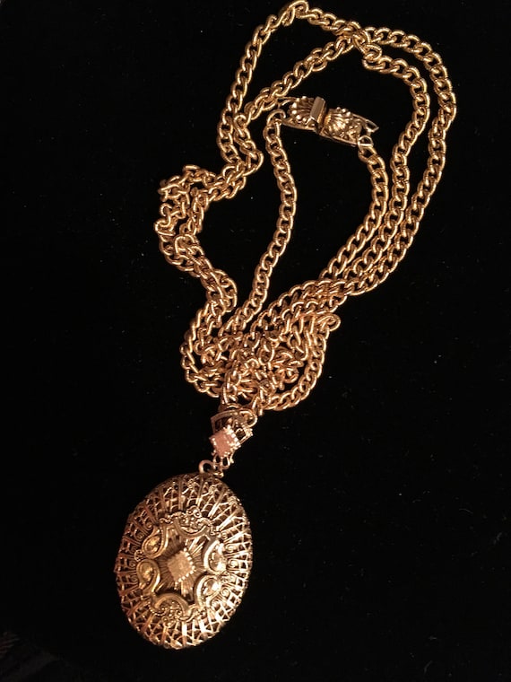 Tuck a couple pics in this filigree brass locket, 