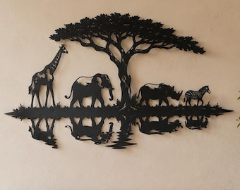 May include: A black metal wall art piece featuring a silhouette of a giraffe, elephant, rhinoceros, and zebra standing under a large tree, with a mirrored reflection effect of the animals and tree base depicted in the lower portion of the design.