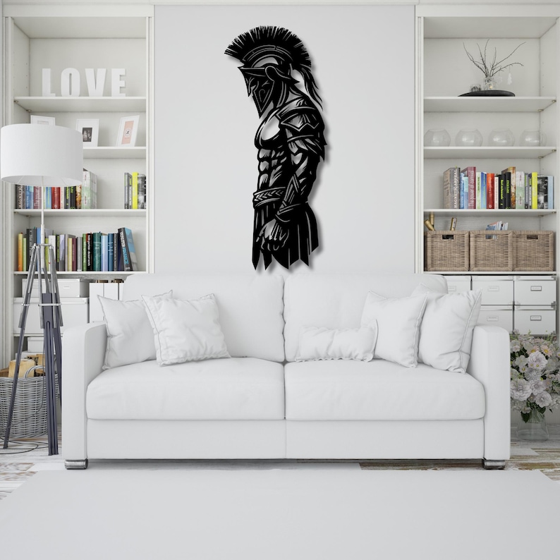 May include: Black metal wall art depicting a Spartan warrior in profile. The artwork features a detailed helmet, armor, and muscular physique. This decorative piece is suitable for home decor, adding a touch of historical and heroic theme.