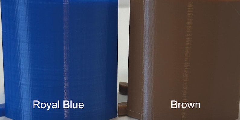 May include: Two solid-colored, rectangular objects are displayed. One is royal blue, and the other is brown. The text "Royal Blue" and "Brown" are printed in white at the bottom of each object.