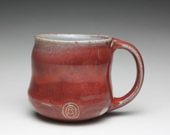red pottery mug