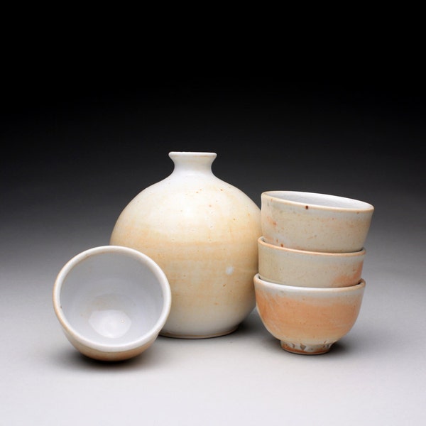 handmade porcelain sake set with white and orange shino glazes