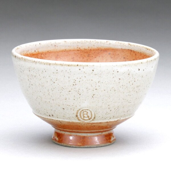 small speckled white and orange shino bowl