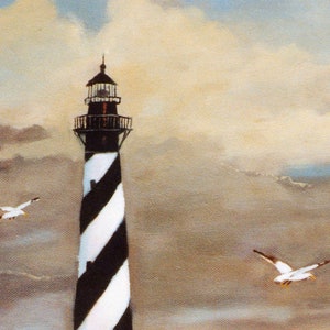 May include: An oil painting of a tall lighthouse with black and white diagonal stripes. Two seagulls fly in the cloudy sky. The lighthouse is topped with a black lantern room and a small spire. The painting has a vintage, coastal theme.