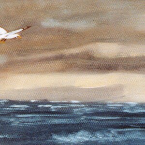 May include: An oil painting depicts a coastal scene with a seagull in flight against a cloudy sky. The ocean waves are dark blue, and the sand is a light tan color. The artwork evokes a sense of tranquility.