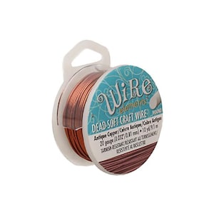 May include: A spool of antique copper dead-soft craft wire. The wire is 20 gauge (0.81 mm) and is labelled as tarnish-resistant. The spool is in a clear plastic container with a white handle. The label reads "Wire elements".