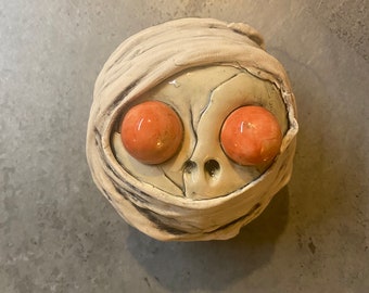 Ceramic mummy head, mask, wall hanging, skull