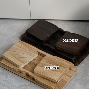 May include: Two wooden serving trays, one dark brown and one light brown, each with a square coaster. The dark brown tray has a matching coaster and the text "OPTION A". The light brown tray has a matching coaster and the text "OPTION B".