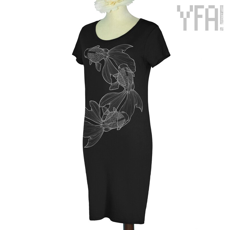May include: Black dress with a white outline of three goldfish on the left side of the dress.