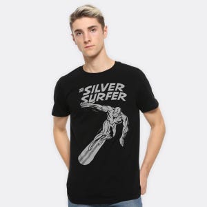 May include: Black t-shirt with a grey graphic of the Silver Surfer surfing. The text "The Silver Surfer" is printed above the character in grey. The t-shirt is short-sleeved and likely made of cotton.