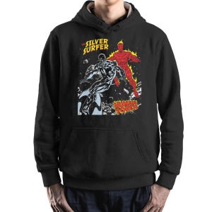 May include: Black hoodie with a comic book illustration of The Silver Surfer and Human Torch. The graphic includes the words "The Silver Surfer" and "Human Torch" in a retro style. The design is in silver, red, and orange.