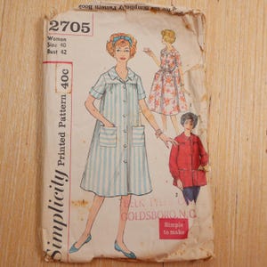 May include: A vintage Simplicity sewing pattern envelope, number 2705, for a woman's size 40, bust 42. The paper envelope features illustrations of three garment styles, including a striped dress with pockets, a floral dress, and a red button-down jacket.