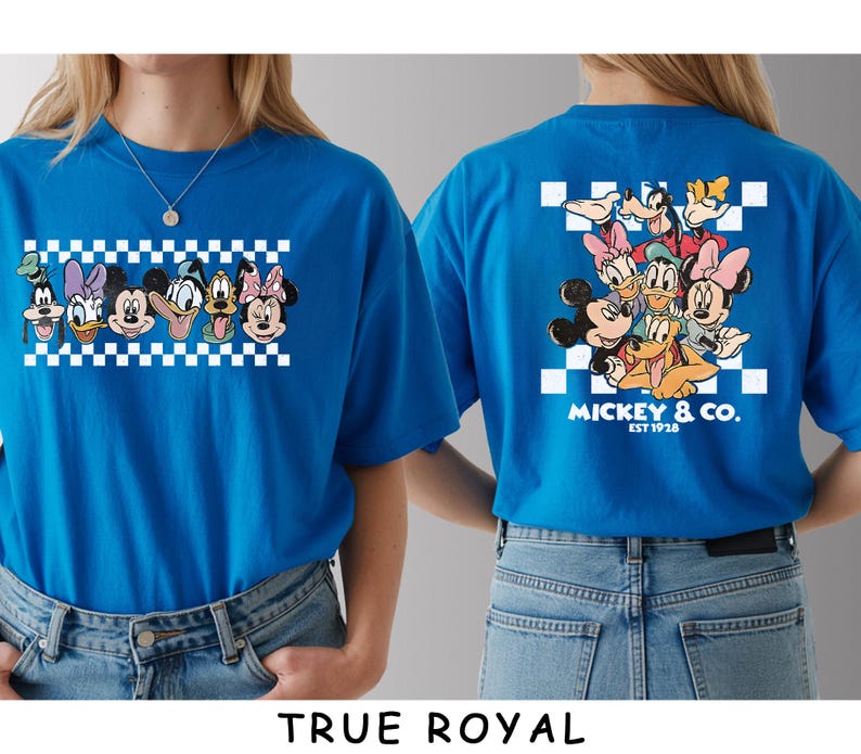 May include: A bright blue t-shirt featuring a graphic of Disney characters including Mickey Mouse, Minnie Mouse, Donald Duck, Daisy Duck, Goofy, and Pluto. The front shows their faces in a row, while the back displays them above the text Mickey & Co. Est 1928.