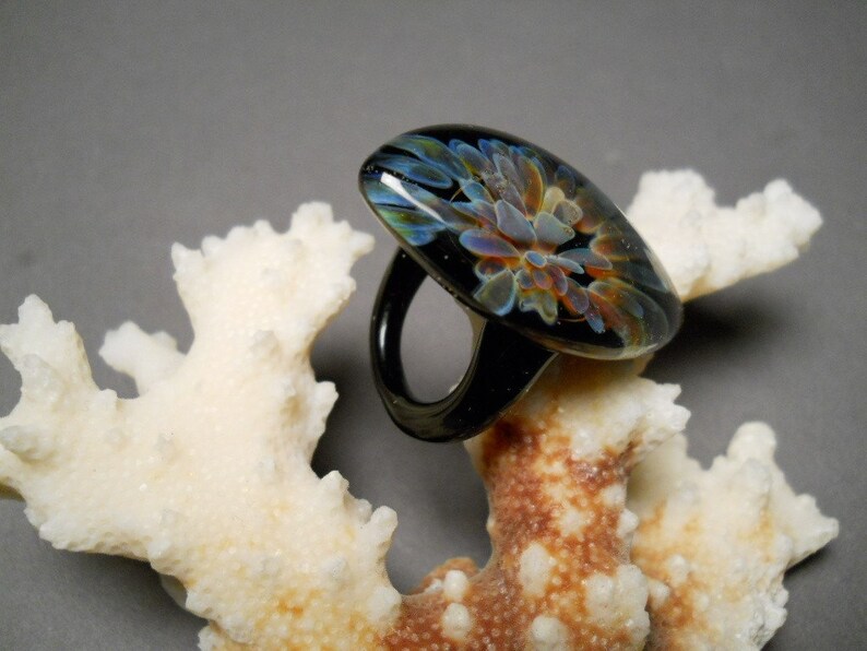 Hand made blown Glass Ring with implosion flower using Etsy