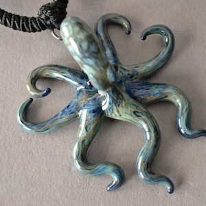 Love Octopus Necklace with tentacles forming two Hearts. A bestseller glass pendant