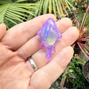 Purple looking slime dripping over a dash of dichroic gold. Great pendy