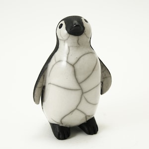 Penguin chick looking up - ceramic raku fired sculpture