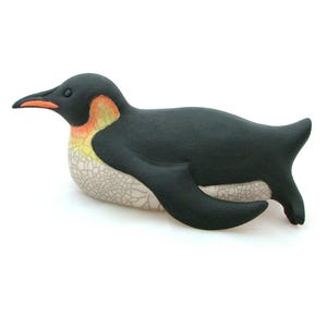 Penguin Tobogganing Emperor King - ceramic raku fired sculpture pottery