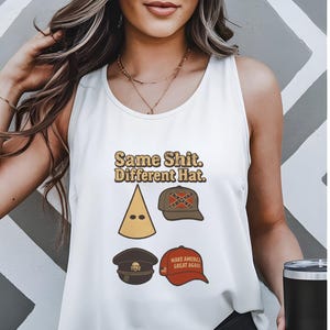 May include: White vest top featuring the text "Same Shit. Different Hat." and illustrations of various hats. The top is worn by a person. The background has a grey and white geometric design.