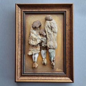 Handmade 3D Painting, Pebble art Family of sea stones on an Brown acrylic background, Framed. Title "Family memory". Artist Rada Lisichka.