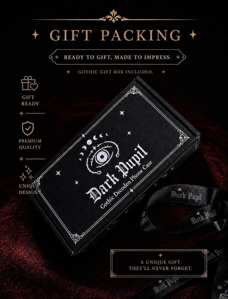 May include: A black rectangular gift box featuring white printed graphics of an eye, moon phases, and stars. The text reads Dark Pupil Gothic Decoden Phone Case. A black ribbon with the text Dark Pupil is included alongside the box.